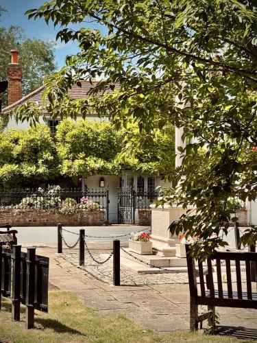 a park bench in front of a house at Plum Bray in Bray