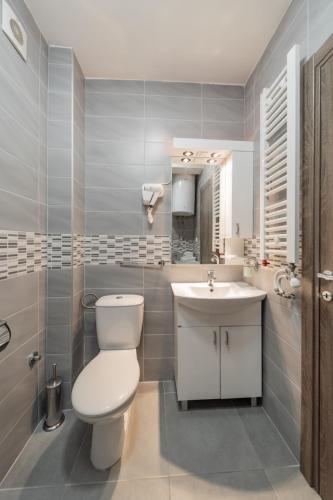 a bathroom with a toilet and a sink at Port 1 in Belgrade