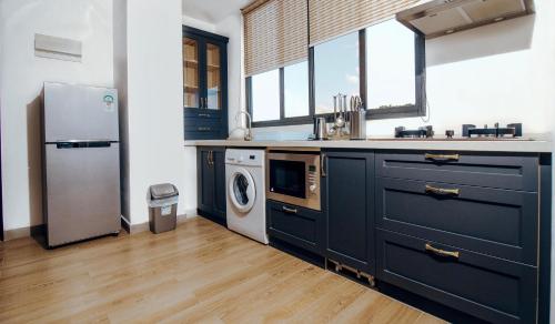 Kuchyň nebo kuchyňský kout v ubytování Tanzanite Serviced Apartment - TSA Masaki