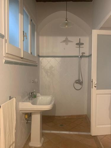 a bathroom with a sink and a shower at Palazzo Carratelli in Amantea