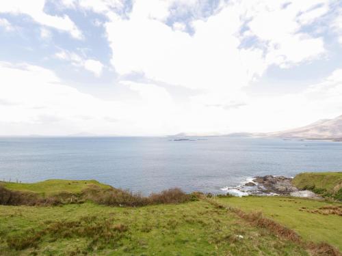 a view of the ocean from the top of a hill at Old Mike's Cottage in Westport
