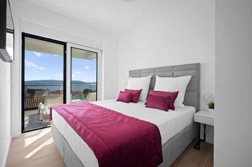 Ένα ή περισσότερα κρεβάτια σε δωμάτιο στο Adriatic Garden Apartments