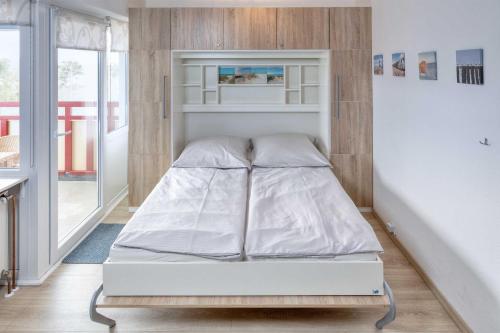 Ένα ή περισσότερα κρεβάτια σε δωμάτιο στο Terrassenhaus, FeWo 73