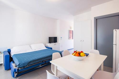 Ένα ή περισσότερα κρεβάτια σε δωμάτιο στο Acquamarina Appartamenti