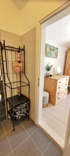 a bathroom with a black shelf next to a sink at Villa Valentina Nin in Ninski Stanovi