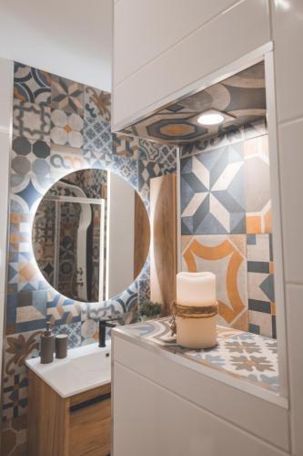 a bathroom with a sink and a mirror at Casa dos Avós - Folgosa Douro in Folgosa