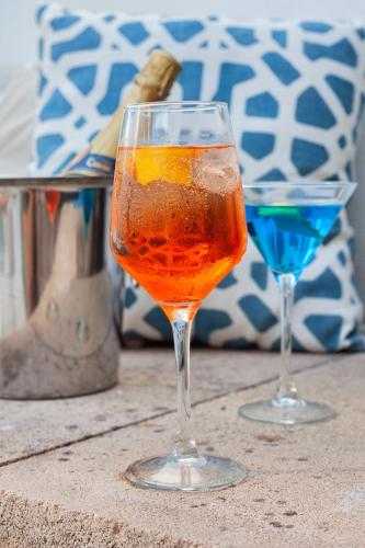 two glasses sitting on top of a table at Flacalco Hotel & Apartments in Cala Ratjada