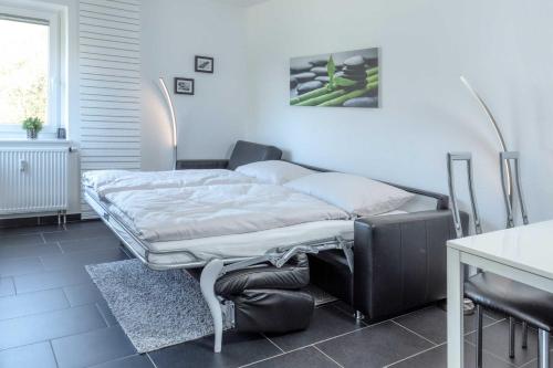 Postel nebo postele na pokoji v ubytování Terrassenhaus, FeWo 20