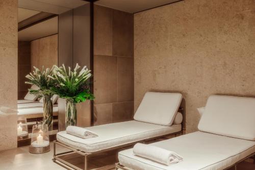 a spa room with two chairs and a mirror at Tivoli Portopiccolo Sistiana Wellness Resort & Spa in Sistiana