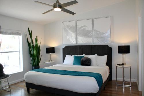 a bedroom with a large bed with a person sitting on it at Death Valley Hot Springs in Tecopa