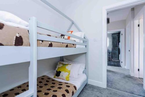 a bunk bed in a room with a bunk beduteneway at Sandileigh Drive by YourStays in Altrincham