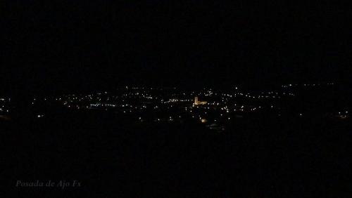 a view of a city at night with lights at Posada de Ajo in Ajo