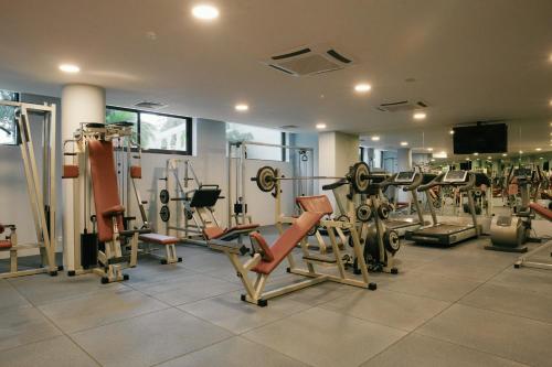 a gym with several treadmills and machines at Admiral Hotel - Ultra All Inclusive & Private Beach in Golden Sands