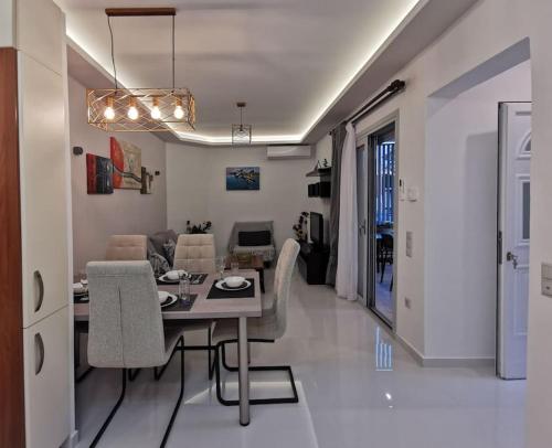 a living room with a couch and a table in it at Keti's home in Athens