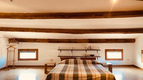 A bed or beds in a room at Cà Sardi