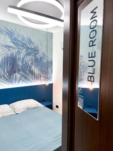 a bedroom with a bed and a sign on the door at The Apartment Agrigento in Agrigento