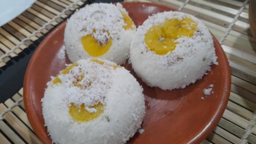 a plate of rice cakes with a face on it at raison d'être - The Residential Library in Trivandrum