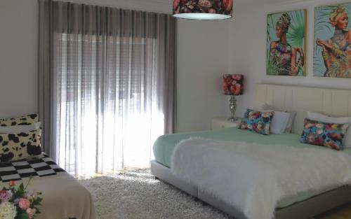 Postel nebo postele na pokoji v ubytování Ricky GuestHouse