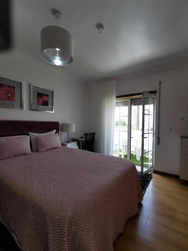 Postel nebo postele na pokoji v ubytování Ricky GuestHouse