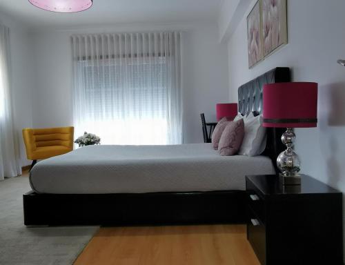 Postel nebo postele na pokoji v ubytování Ricky GuestHouse