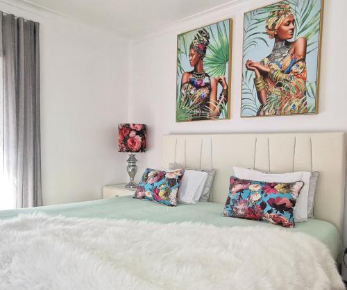 Postel nebo postele na pokoji v ubytování Ricky GuestHouse