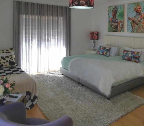 Postel nebo postele na pokoji v ubytování Ricky GuestHouse