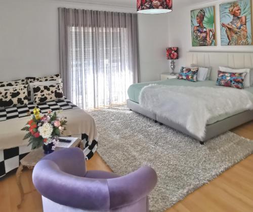 Postel nebo postele na pokoji v ubytování Ricky GuestHouse