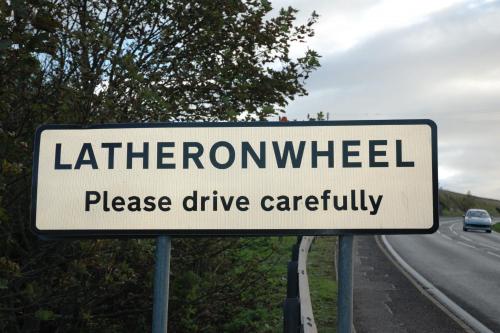 a street sign on the side of a road at Craiglea Lodge & Barn in Latheron
