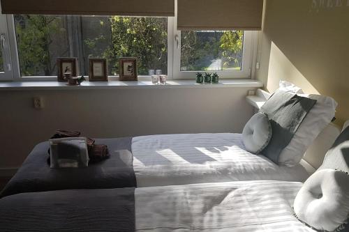 Postel nebo postele na pokoji v ubytování Waterhill's Bed & Wellness