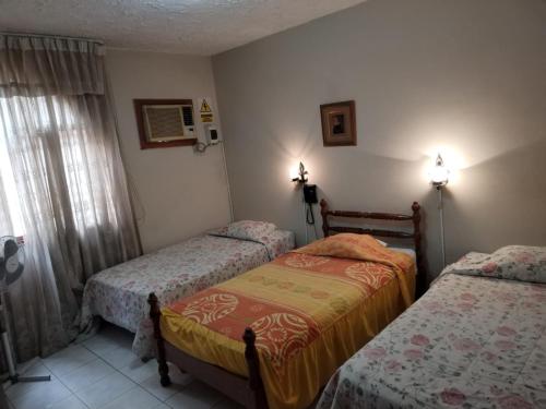 Postel nebo postele na pokoji v ubytování LA SIESTA-Hotel