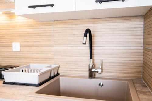 a sink in a kitchen with a sink at Kos Olympia Apartment superior in Kos Town