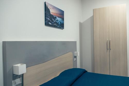 Posteľ alebo postele v izbe v ubytovaní BluMarine Appartaments