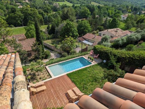 an aerial view of a house with a swimming pool at CASA AUGUSTA in Riez