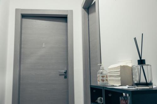a door in a room with a mirror at BluMarine Appartaments in Paola