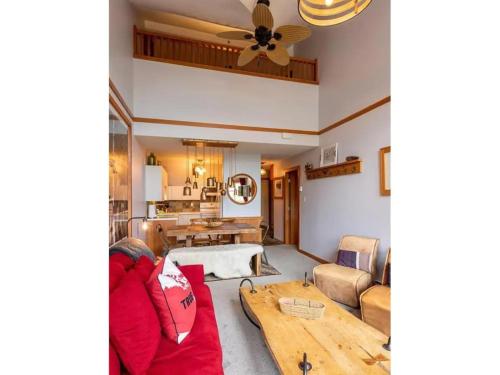 a living room with a couch and a table at Glacier Lodge Steps to Trails and Nature in Whistler