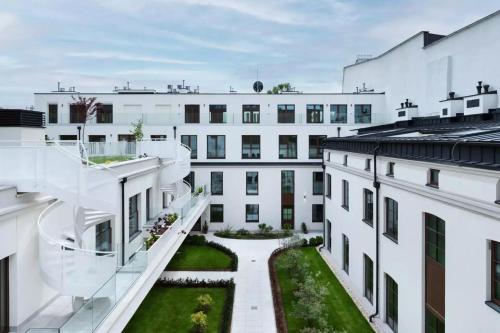a view from the balcony of a white building at Apartament Złota winda Tuwima in Łódź