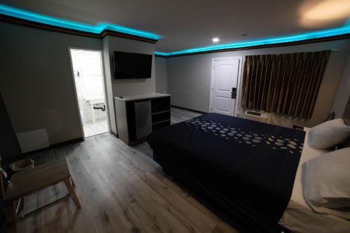 Katil atau katil-katil dalam bilik di Artesia Motor Inn