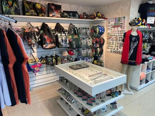 a store with a shelf with helmets and shoes at Cataratas Park Hotel e Eventos in Foz do Iguaçu
