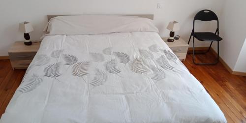 Ένα ή περισσότερα κρεβάτια σε δωμάτιο στο La Marmotte