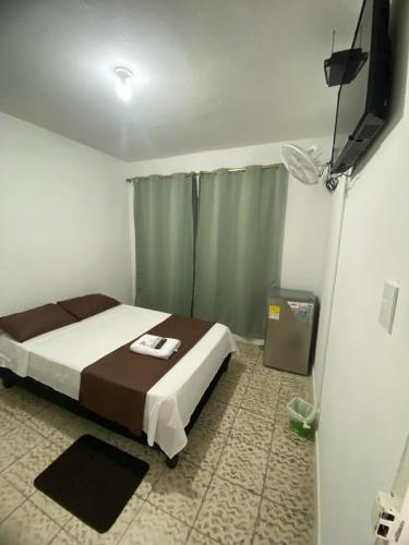 Postel nebo postele na pokoji v ubytování HOSPEDAJE'S HE