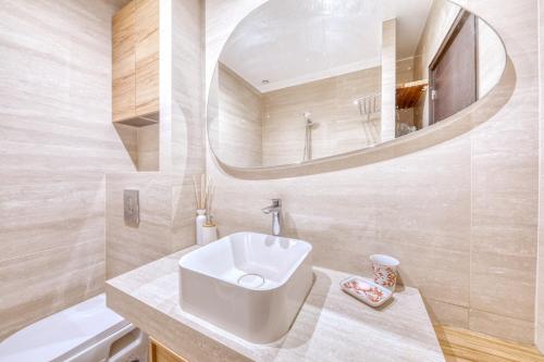 a bathroom with a sink and a mirror at Peaceful Haven, Terrace in Nice in Nice