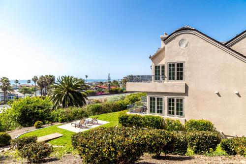 an image of a house with a yard at Villa L'Auberge in San Diego