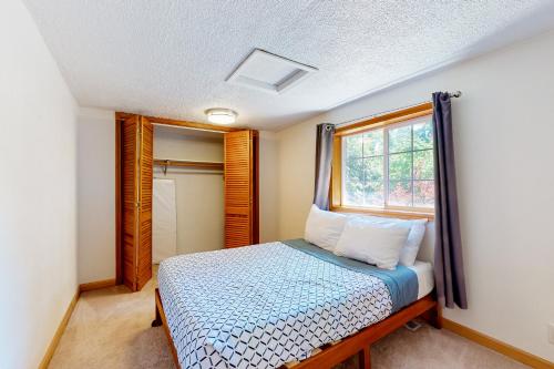 a bedroom with a bed and a window at Wonder on Whiskey Road in Warrenton