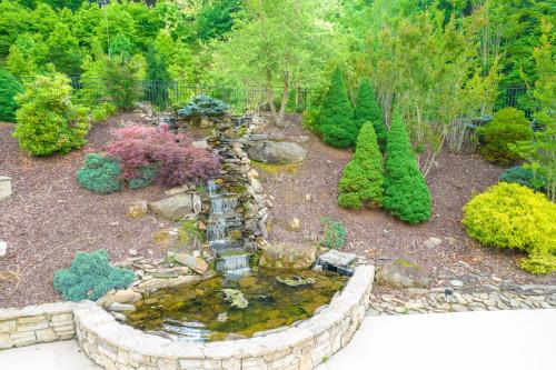 a garden with a water fountain in a yard at Link Vacation in Whittier