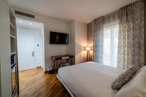 a bedroom with a large bed and a window at Hortus Natural Living in Todi
