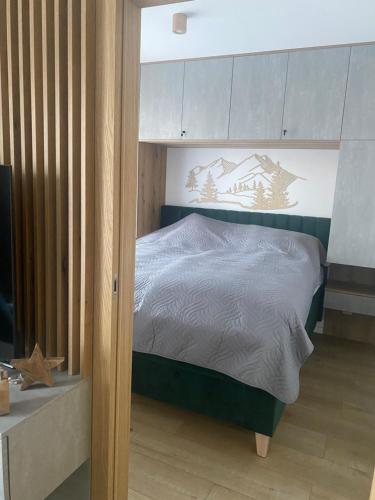 Ένα ή περισσότερα κρεβάτια σε δωμάτιο στο Hugo Family Apartment