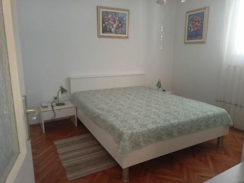 Ένα ή περισσότερα κρεβάτια σε δωμάτιο στο Marko Apartments Porec