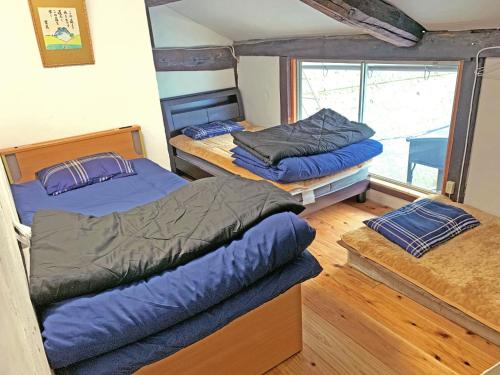 a room with two beds and a window at Kosangan - Vacation STAY 66866v in Nagahama