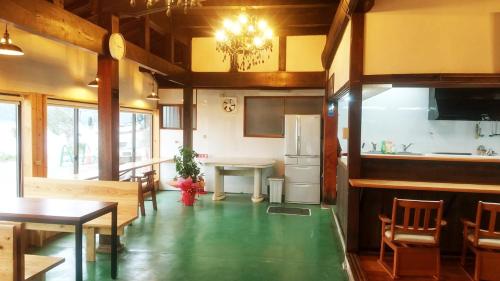 a kitchen and dining room with a green floor at Kosangan - Vacation STAY 66866v in Nagahama