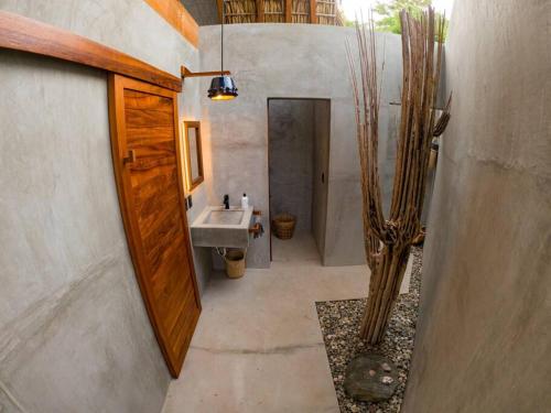 a bathroom with a sink and a sink at Gotita in Yolina